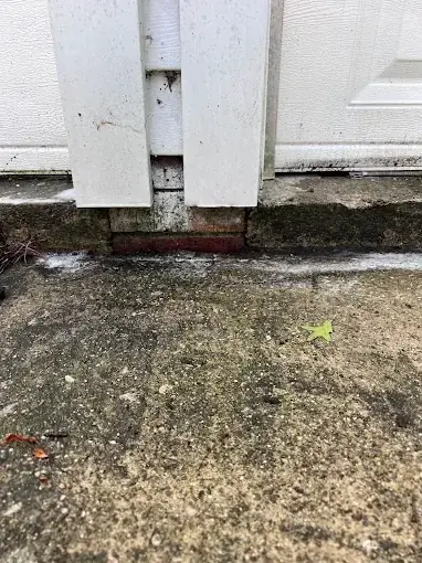 Sunken slab leaving a gap under a door before lifting