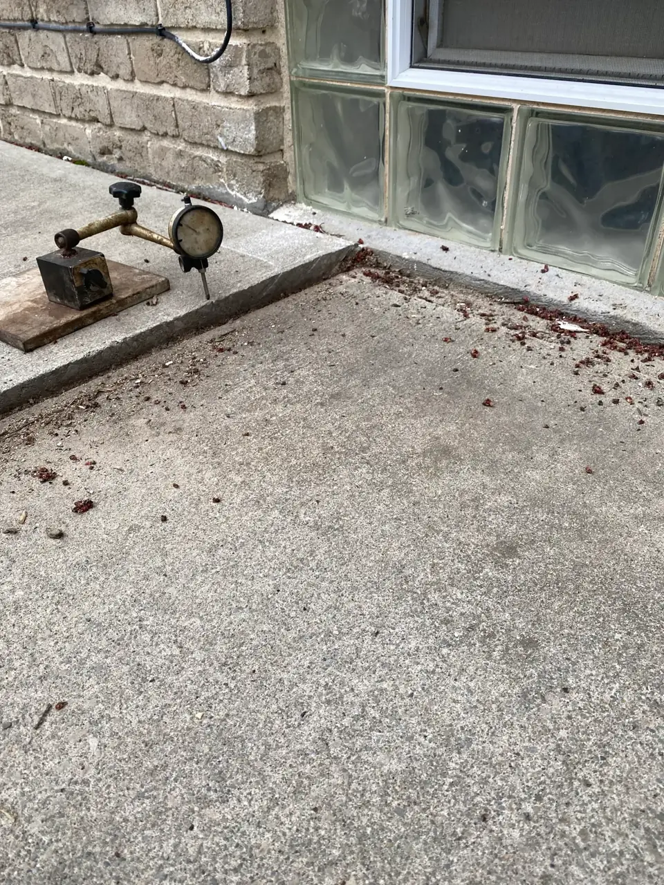 Sunken patio slab with a gap before lifting